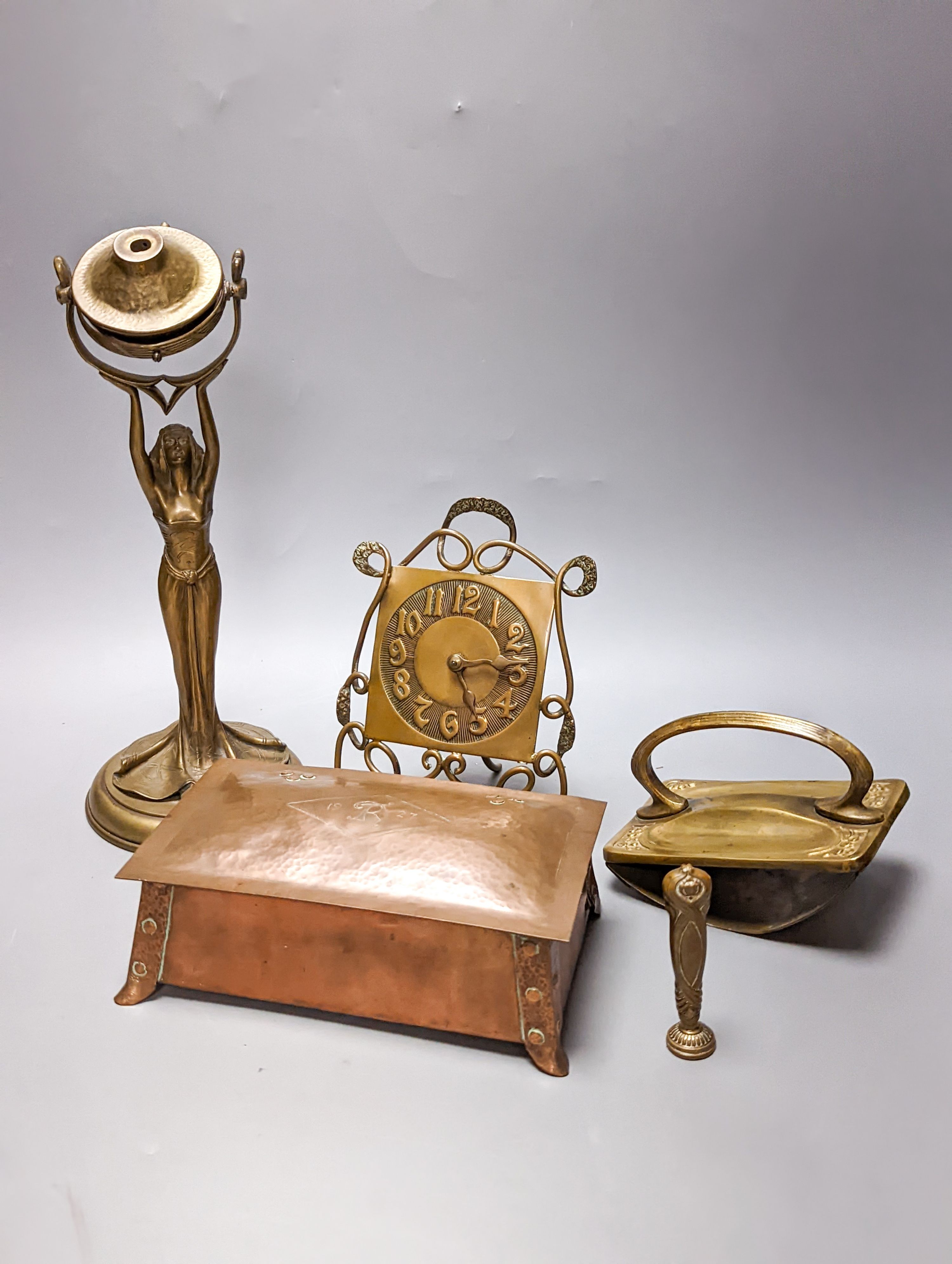 An Arts and Crafts brass/copper group - figural gimbal lamp, mantle timepiece, lidded box etc.
